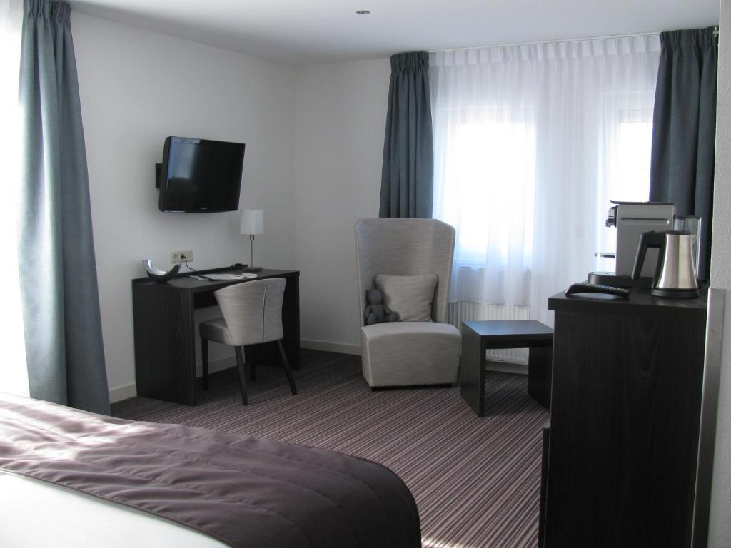 Boutique Hotel De Zwaluw De Koog  Rum bild
