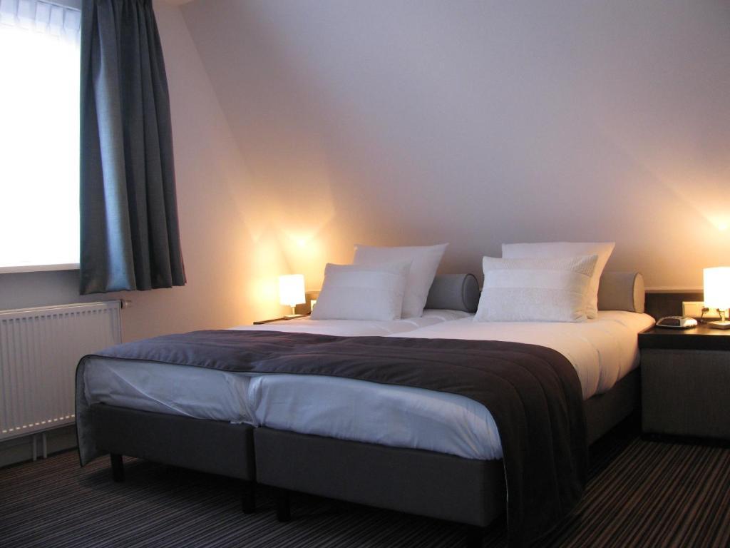 Boutique Hotel De Zwaluw De Koog  Rum bild